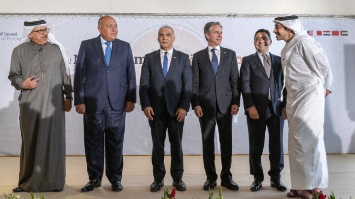 After meeting for a summit in Israel’s Negev desert, Bahrain's Foreign Minister Abdullatif Al Zayani (L), Egypt's Foreign Minister Sameh Shoukry, Israel's Foreign Minister Yair Lapid, US Secretary of State Antony Blinken, Morocco's Foreign Minister Nasser Bourita, and United Arab Emirates' Foreign Minister Sheikh Abdullah bin Zayed Al Nahyan stand for a group photograph on March 28, 2022, in Sde Boker.